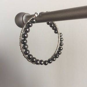 Black and silver beaded hoop earrings.